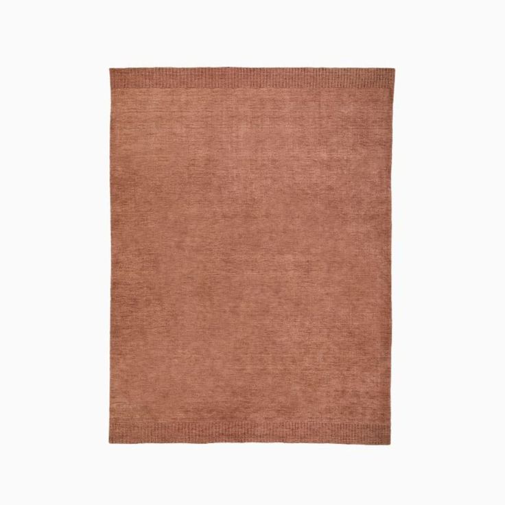 a brown rug on a white background with no one in it or someone out there