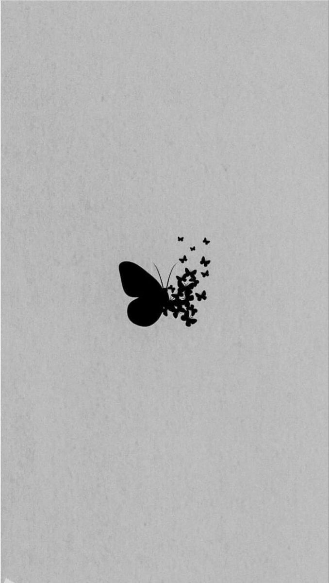 a black and white photo of a butterfly flying in the sky with lots of butterflies