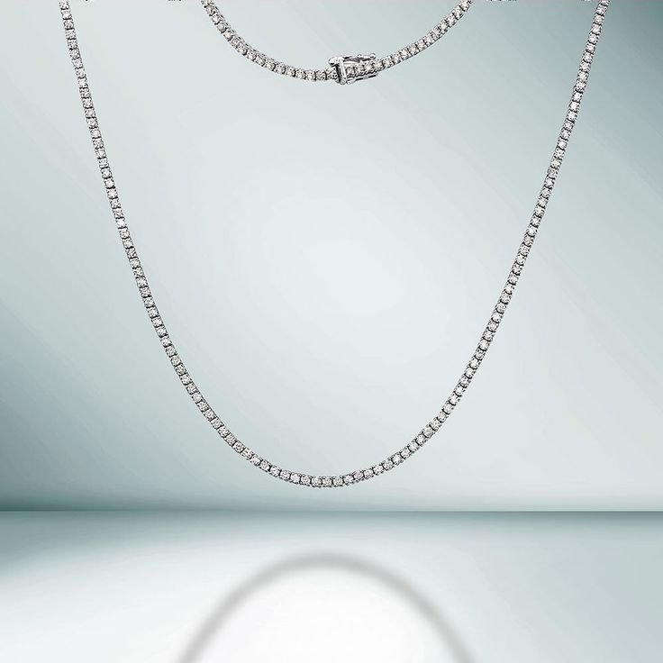 The Diamond Tennis Necklace is a stunning piece of jewelry that features a total of 8.05 carats of high-quality diamonds set in 14K gold. Each diamond is secured by a 4-prong setting, ensuring that they are held securely in place and allowing them to shine brilliantly. The diamonds are carefully selected for their exceptional quality, all our diamond are 100% natural. The necklace is designed with a delicate chain that sits elegantly around your neck, making it the perfect accessory for any occasion. Whether you're looking to add some sparkle to your everyday wear or to make a statement at a special event, this Diamond Tennis Necklace is sure to impress. It's a timeless piece that will be cherished for years to come. PRODUCT DETAILS: Metal Type: 14K Gold Gold Weight: 15.50 gr. Diamond Weig Beautiful Diamond Necklace, Diamond Tennis Necklace, 14k Yellow Gold Necklace, White Gold Necklaces, Tennis Necklace, Travel Jewelry, Natural Earth, Diamond Sizes, Box Chain