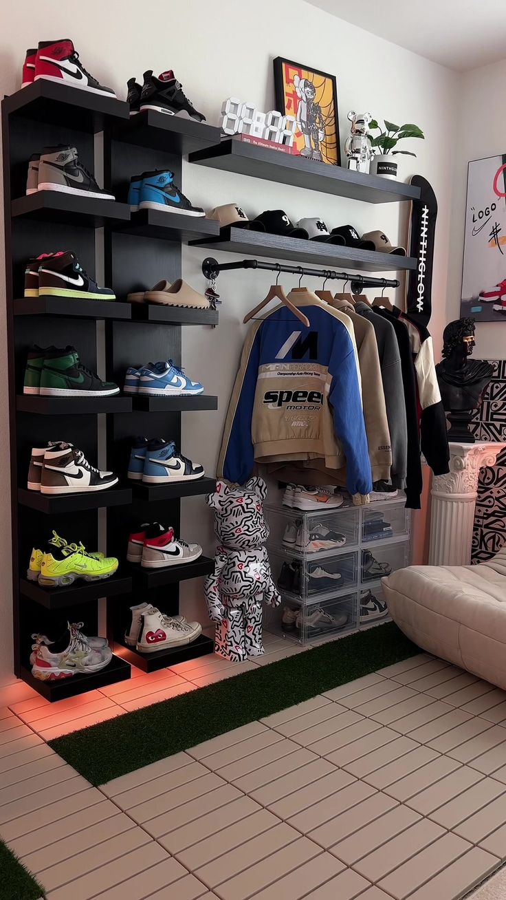 a room filled with lots of shoes and clothing hanging on the wall next to a couch