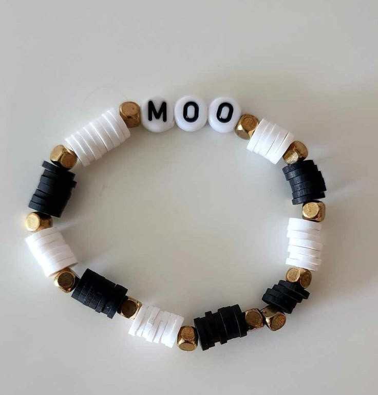 This Moo bracelet is perfect for a causal look. It is 17 centimeters long and is able to fit a kid. Western Clay Bead Jewelry, Cow Clay Bead Bracelet, Cowgirl Clay Bead Bracelet, Morgan Wallen Clay Bead Bracelet, Black And White Clay Bead Bracelet, Western Bracelets Clay Beads, Western Bracelet Ideas, Western Clay Bead Bracelet Ideas, Country Clay Bead Bracelet Ideas