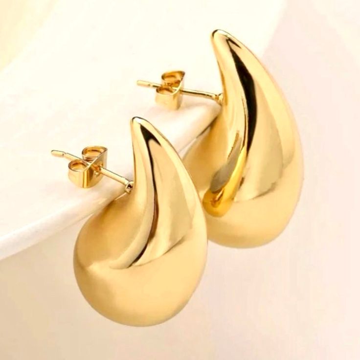 Handcrafted earrings, gold plated teardrop shape earrings. So feminine and versatile. We adore these pretty shaped earrings, wear them with Jeans and a t-shirt or dressed up. Gold plated chunky earrings Made with love in Los Angeles Complimentary gift wrapping provided All sales final. Gold Plated Teardrop Earrings For Party, Yellow Gold Teardrop Hoop Earrings, Modern Gold Pear-shaped Teardrop Earrings, Modern Gold Teardrop Earrings, Modern Gold Teardrop Crown Earrings, Gold Pear-shaped Teardrop Single Earring, Gold Teardrop Earrings Tarnish Resistant, Gold Teardrop Pierced Earrings, Gold Plated Drop Teardrop Earring