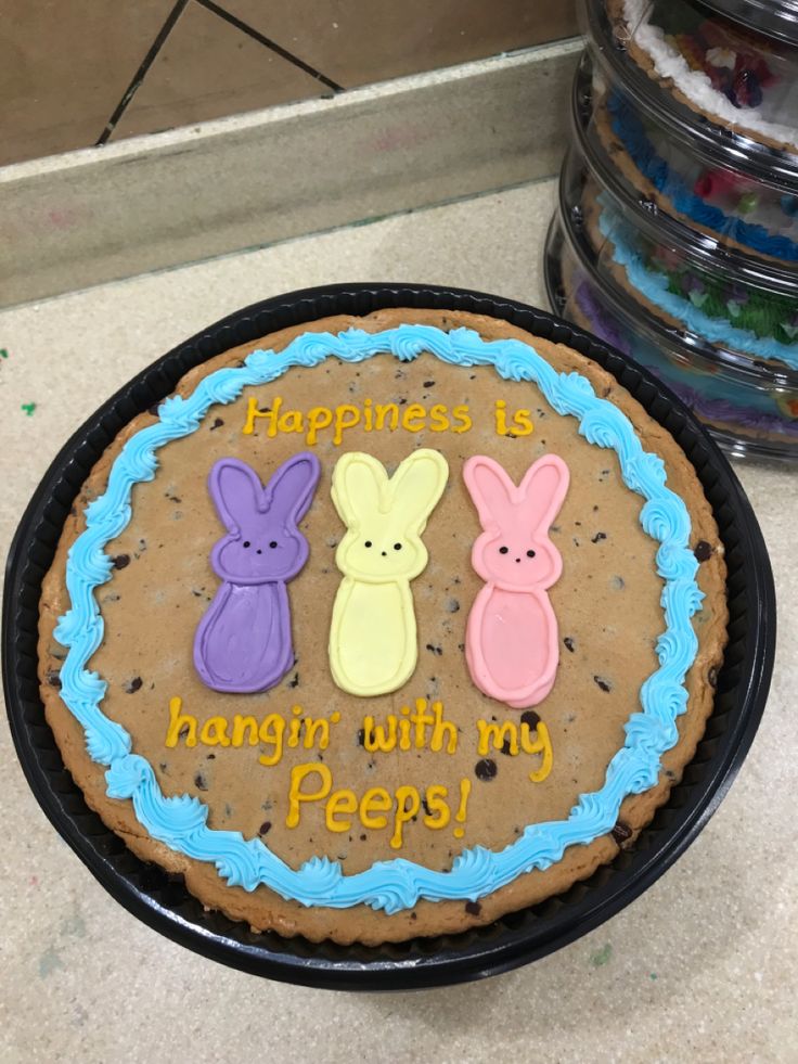 a birthday cake decorated with bunnies and the words happiness is hungin with my pees