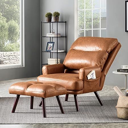 a brown leather recliner chair and ottoman in a living room with a window behind it