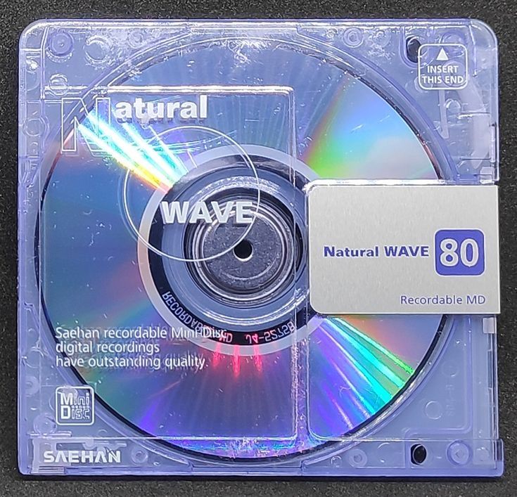 a cd that is sitting on top of a plastic case with an ad for natural wave