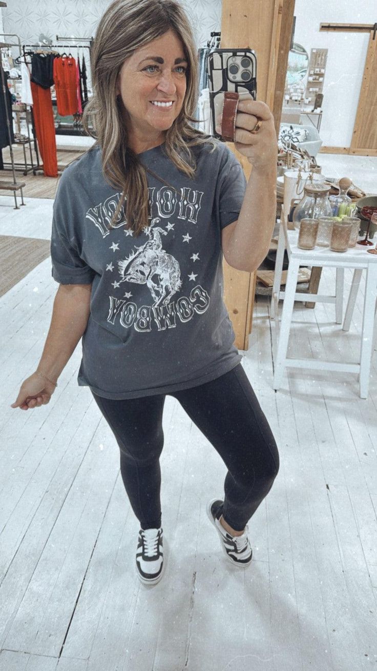 Details: We love a cute graphic tee, and this one is giving us fun vibes for Fall. We can't wait to layer it with our favorite flannels, denim jackets, and cardigans, and in the meantime, she's right at home with our Summer shorts! A great length, soft feel, and perfect fit too! Fit: Fits true to size. S/M (0-8), M/L (10-14) Materials & Care: 100% cotton. Machine wash cold, gentle cycle, lay flat to dry. Grunge Style Text Print Tops For Fall, Graphic Print Tops For Fall Loungewear, Graphic Print Tops For Loungewear In Fall, Trendy Graphic Print T-shirt For Fall, Trendy Tri-blend Soft-washed Tops, Grunge T-shirt With Text Print For Fall, Grunge Fall T-shirt With Text Print, Grunge Text Print T-shirt For Fall, Fun Fall Top With Letter Print