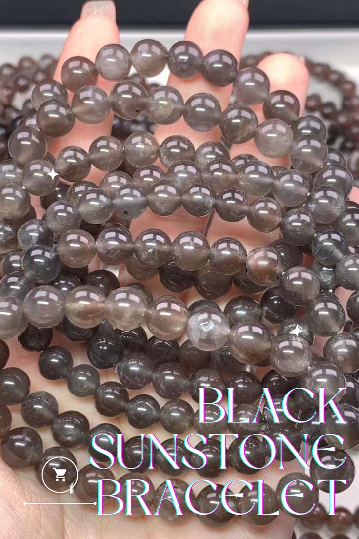 This fashionable Black Sunstone Bead Bracelet is a great way to enhance your look. Crafted from natural black sunstone beads, this bracelet makes a timeless fashion statement. The natural stone beads help to absorb negative energy and aid in emotional balance. Size: 5-11.5mm Affordable Black Crystal Bracelet With Round Beads, Obsidian Beaded Bracelets With Natural Stones, Obsidian Beaded Bracelets For Healing, Obsidian Gemstone Beads Crystal Bracelet, Obsidian Crystal Bracelet With Gemstone Beads For Healing, Natural Stone Beads, Emotional Balance, Wholesale Beads, Beading Supplies