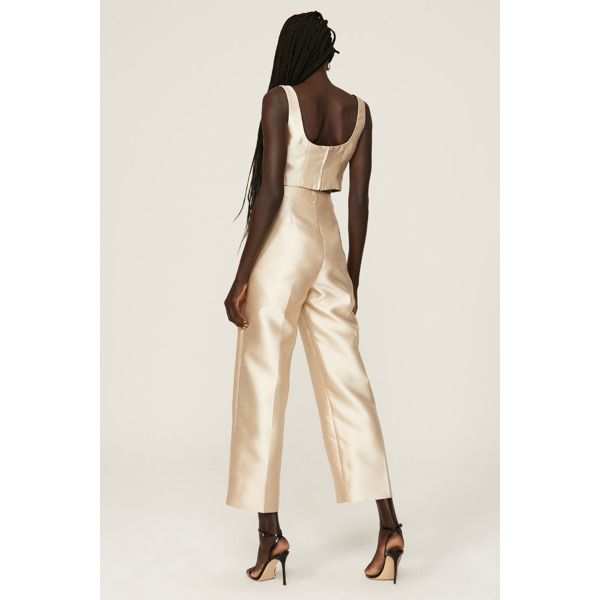 Ivory satin (100% Polyester). Lining (100% Recycled Polyester). Pants. Front zipper closure. 26" inseam. 12" rise. imported. Beige Pants For Spring Evening, Gold Silk Bottoms For Party, Elegant Beige Party Bottoms, Fitted Silk Cream Bottoms, Cream Evening Trousers, Chic Cream Pants For Evening, Elegant Beige Pants For Party, Elegant Beige Party Pants, Elegant Gold Silk Bottoms