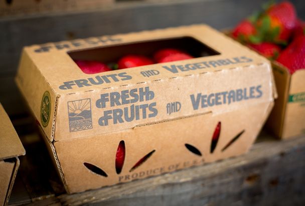 an open box of fresh fruits and vegetables