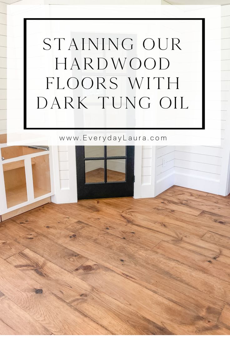 a wood floor with the words staining our hardwood floors with dark tun oil