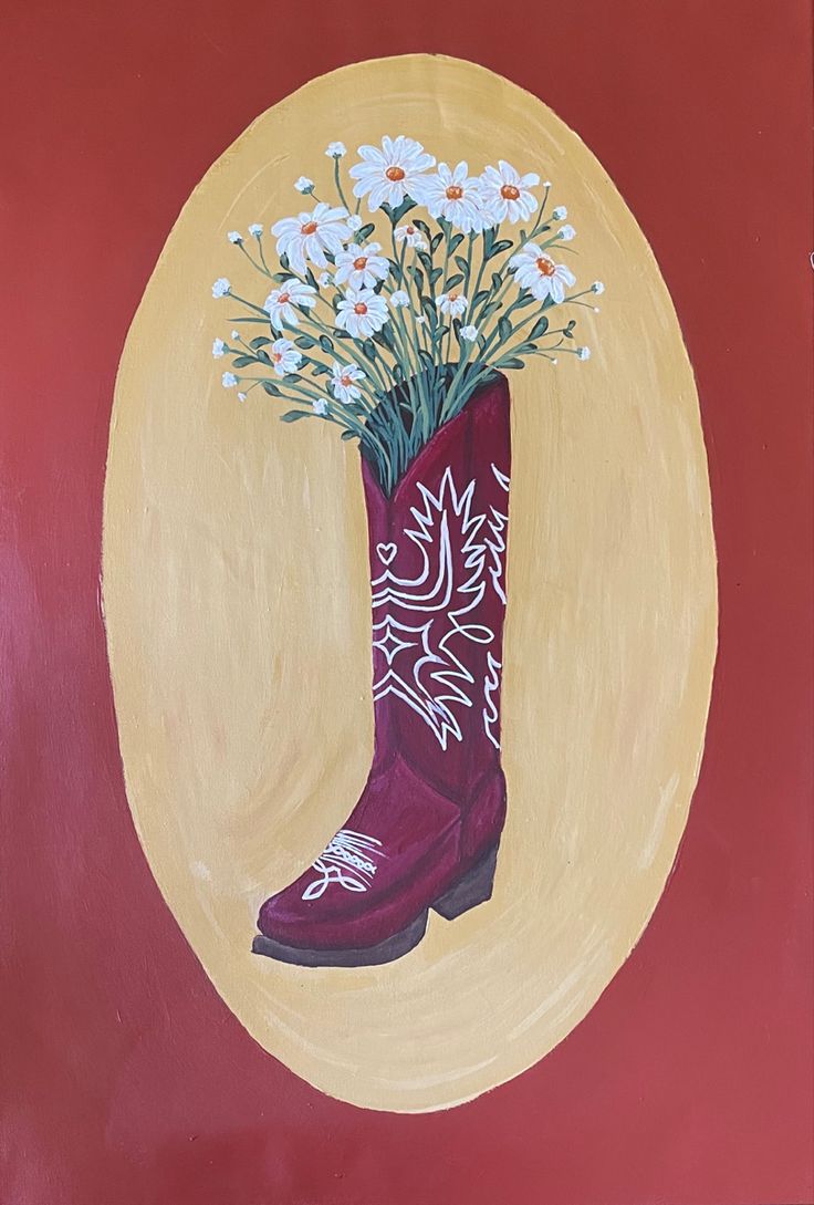 a painting of a cowboy boot with daisies in the center and an oval background