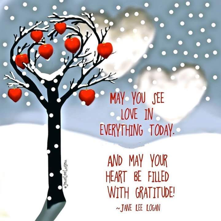 an apple tree with hearts on it in the snow