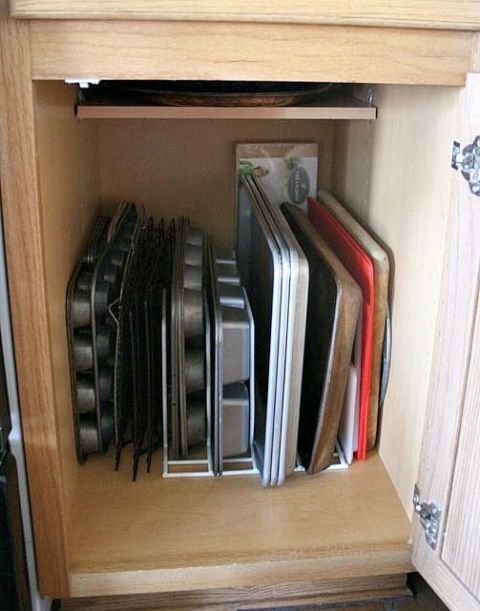 an open cabinet filled with lots of books