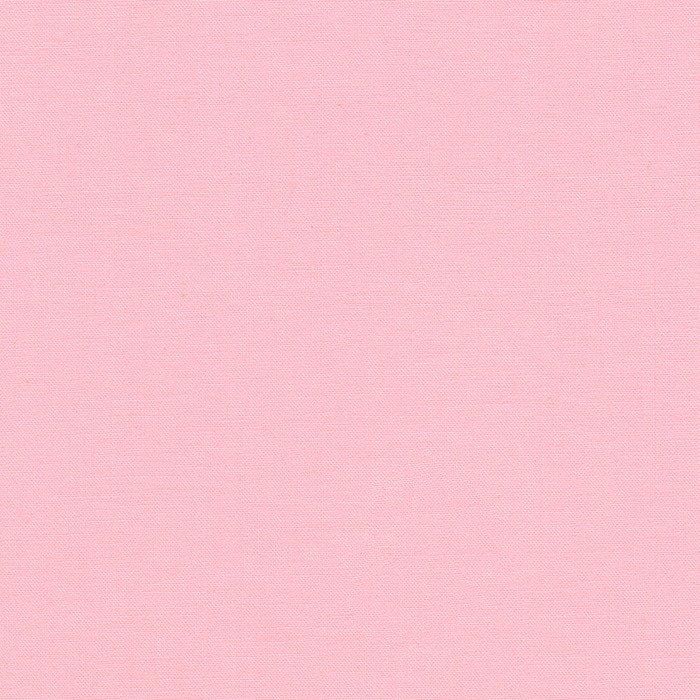 a pink background with some white dots on it