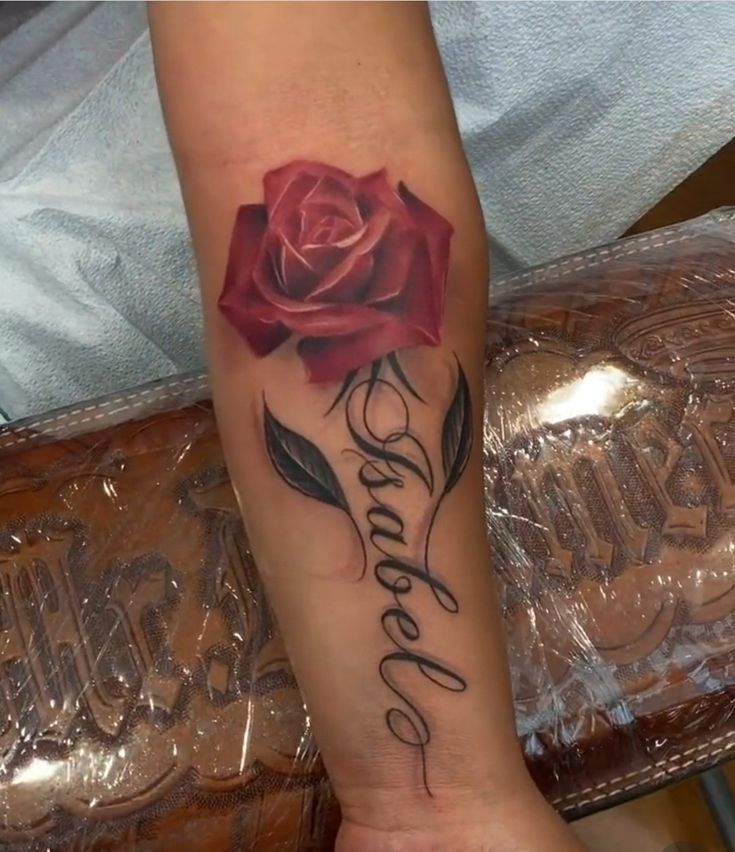 a rose with the word love written on it is shown in this tattoo style photo