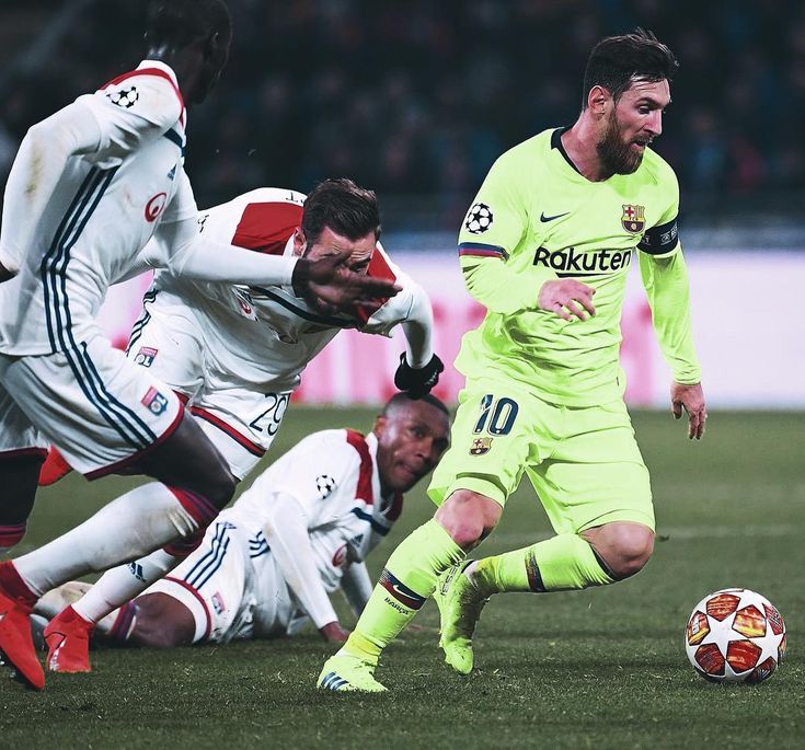 three soccer players in action on the field