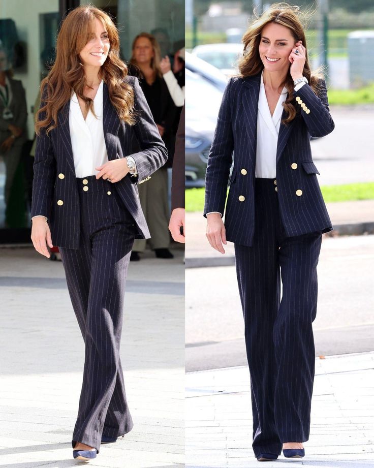 two women in business attire walking down the street talking on their cell phones and smiling