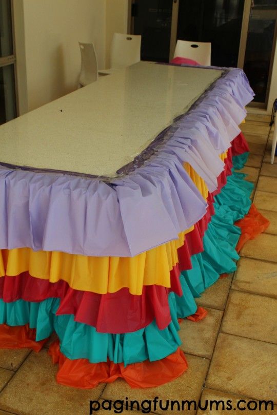 a table that is covered with colorful ruffles