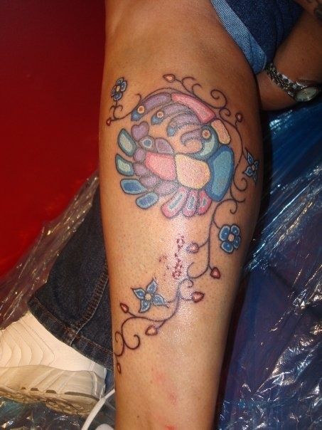 a person with a tattoo on their leg