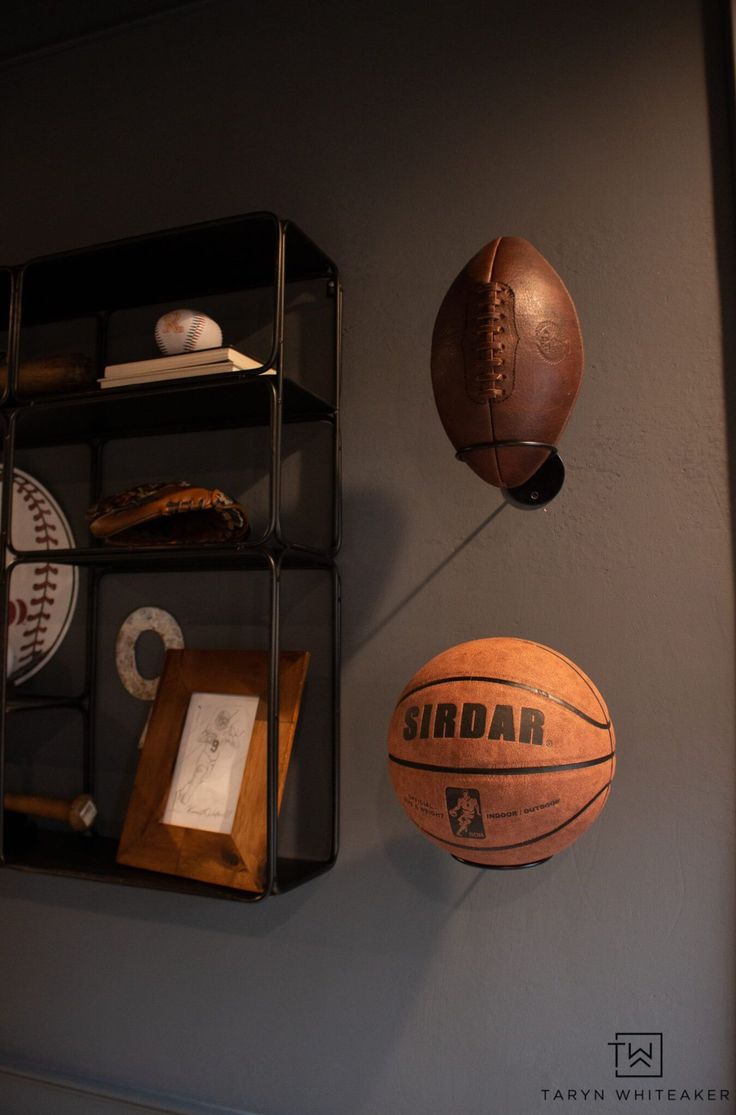 there is a basketball and other sports items on the wall