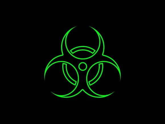 a green biohazard symbol on a black background