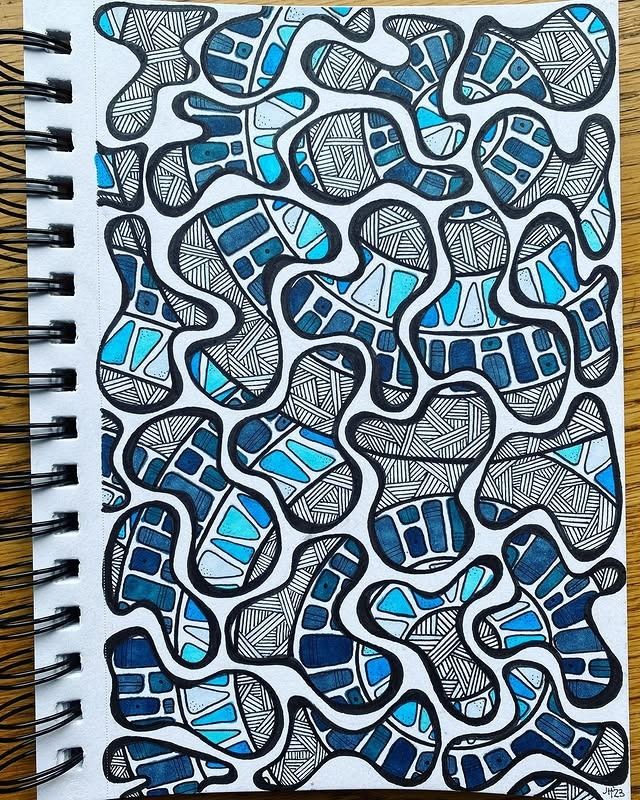 a notebook with blue and white designs on it