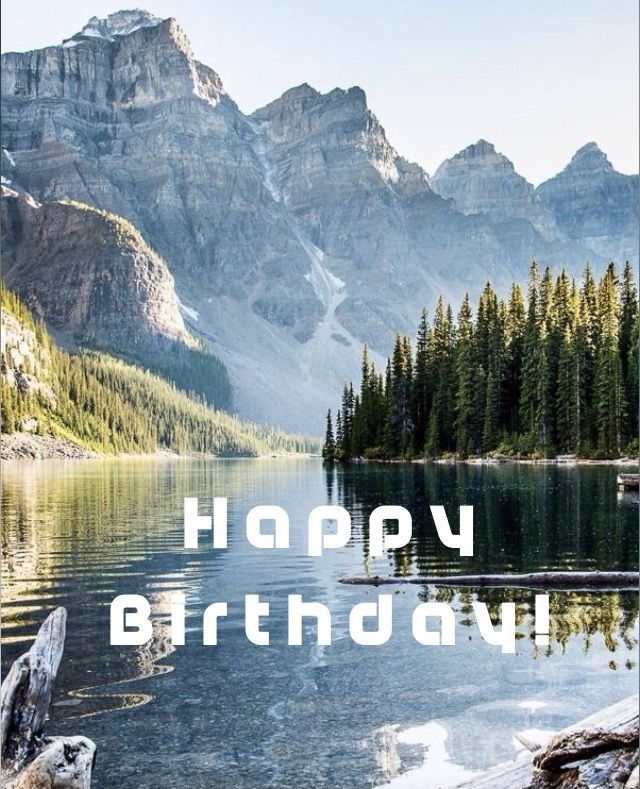 a birthday card with the words happy birthday in front of a mountain lake and pine trees