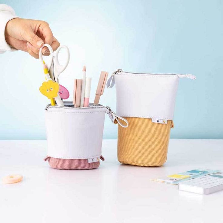 Features:Designed exclusively by our team in Tokyo, our Pop-Up Pencil Case is perfect for storing all your stationery staples! Made from super soft cord + vegan leather, this aesthetic pencil case goes with you, wherever you are. Simply pop it down for a functional desk pen pot, and up for taking on the go! Mix + match between 5 cute pastel colorways for the full experience. Doubles as pen pot and pencil case Holds more than 35 pens 20 cm x 12.5 cm (even fits tomboys!) Shipping Shipping is compl Trendy White Pencil Case For Daily Use, Trendy Pencil Case With Pen Holders For School, Trendy Everyday Pencil Case With Pen Slots, Trendy White Pencil Case With Pen Holders, Trendy Study Pencil Case, Trendy White Stationery For Personal Use, Trendy White Stationery With Pen Slots, Trendy Stationery With Pen Slots For Personal Use, Trendy Portable Pencil Stationery