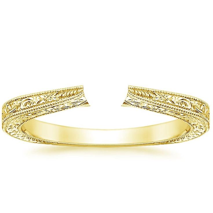 This delicate vintage style setting is hand-engraved with ornate nature-inspired imagery and delicate milgrain on the top and sides of the band for a beautiful light-catching effect. A sizing bar in the back allows for future adjustments. Elegant Etched Wedding Bands For Formal Occasions, Elegant Yellow Gold Ring With Engraving Option, Elegant Yellow Gold Engraved Ring, Elegant Etched Filigree Ring For Anniversary, Elegant Ceremonial Ring With Engraving Option, Elegant Etched Filigree Anniversary Ring, Elegant Engraved Ring For Ceremonial Occasions, Elegant Yellow Gold Filigree Ring For Ceremonial Occasion, Heirloom Gold Engraved Ring With Intaglio