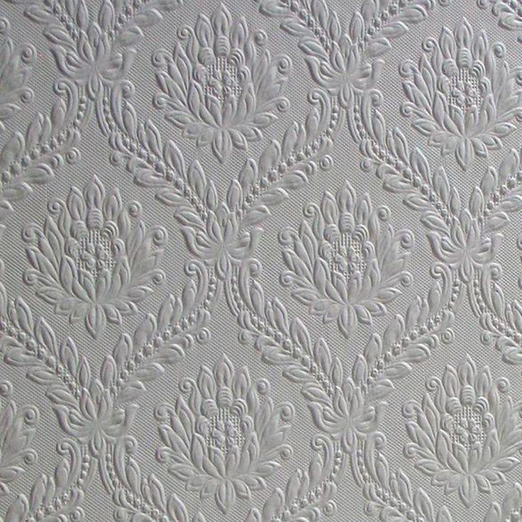 the textured wallpaper is white and has an intricate design on it's surface