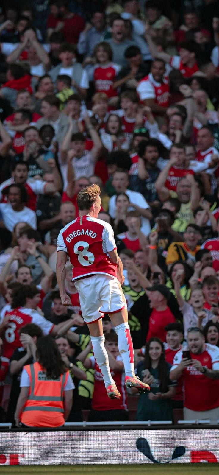 a soccer player is jumping in the air