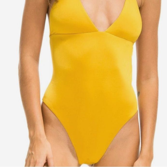 Yellow Plunge High Leg One Piece Bikini Size: Medium Color: Yellow Notes: Nwot, Never Worn Details: Nice Material No Padding Cross Back High Leg Cut Plunge Neckline Thick Straps Occasions: Vacation, Resort, Travel, Bachelorette, Party, Bride, Bridal, Birthday, Tropical, Sexy, Date Night, Barbie, Wedding Guest, Date Night, Brunch, Boho, Cottage, Fairy, Beach, Gno, Work, Office, Bridal Shower. Tags(For Exposure) Zara, Revolve, Meshki, Babyboo, Sabo Skirt, Fashionnova, Shein, Princess Polly, House Trendy V-neck Swimwear For Summer, V-neck Stretch Bodysuit For Beach Party, Trendy Solid Color Swimwear With Lined Body, Seamless V-neck Bodysuit For Poolside, Party Swimwear With Built-in Bra And V-neck, Trendy V-neck Swimwear For Beach, Low-cut Beachwear Swimwear For Spring, Spring Low-cut Beachwear Swimwear, Summer V-neck Seamless Bodysuit