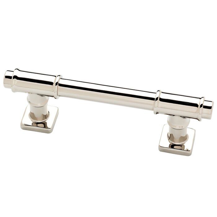 two chromed metal handles on the top of a white door handle with square knobs