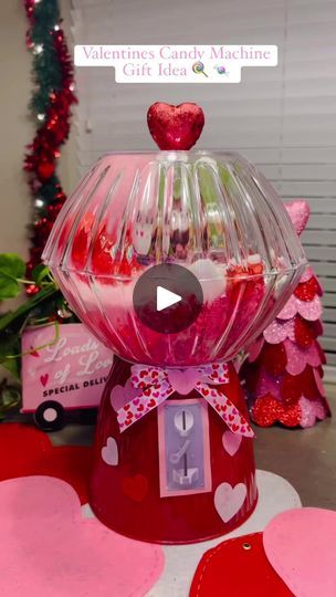 a valentine's candy machine with hearts around it