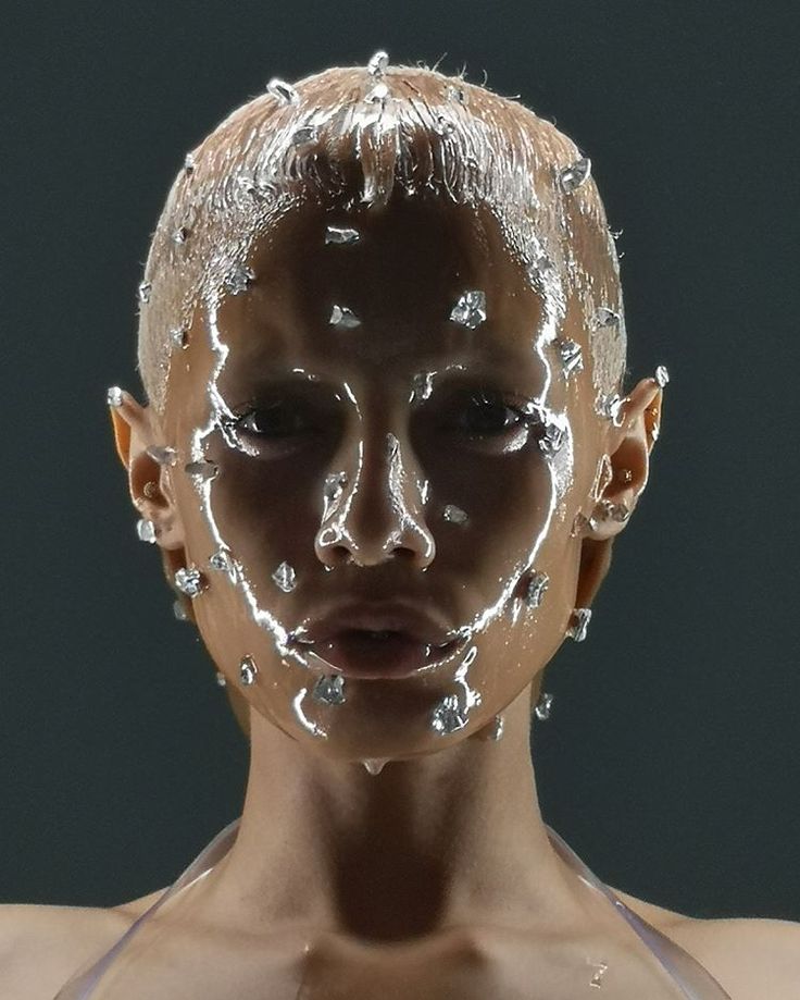 a woman's face is covered with water droplets