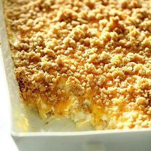 a casserole dish with crumbs on top in a white baking dish