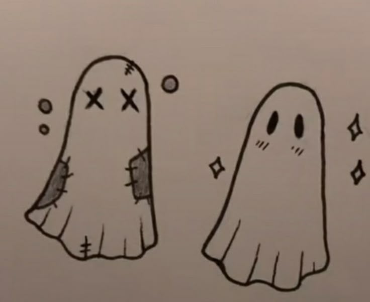 two cartoon ghost like objects with crosses on them