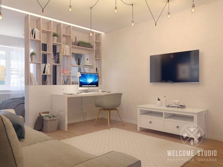 a living room filled with furniture and a flat screen tv mounted to the side of a wall