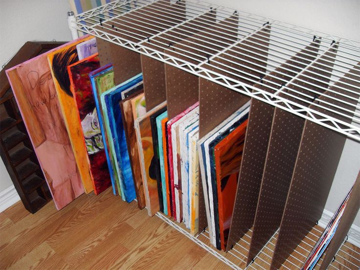 a rack that has many different colored books on it and some metal bars attached to the sides