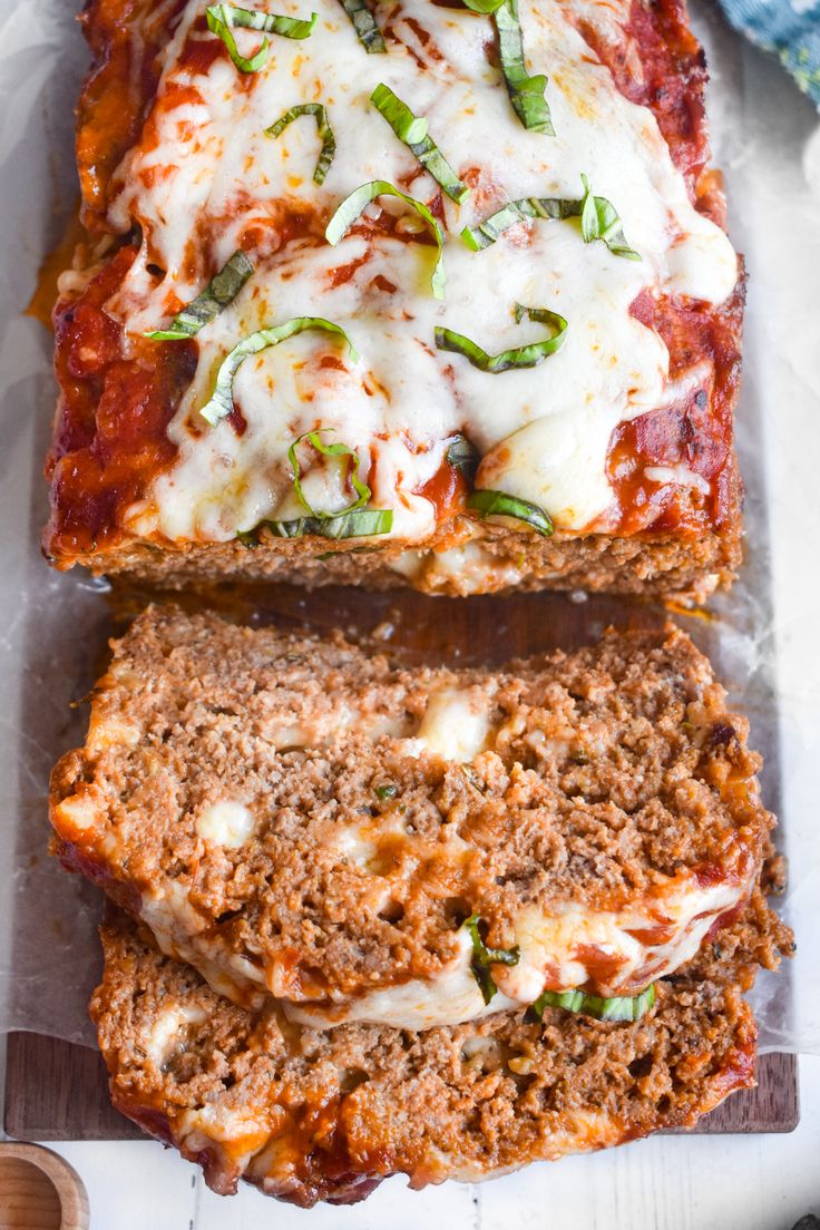 two slices of meatloaf with cheese on top