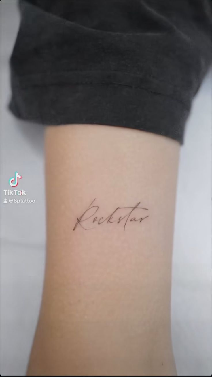 a woman with a tattoo on her leg that says bestfrit in cursive writing