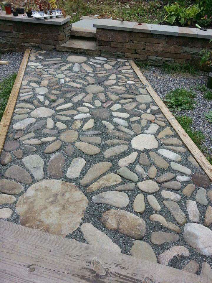 a walkway made out of stones and wood