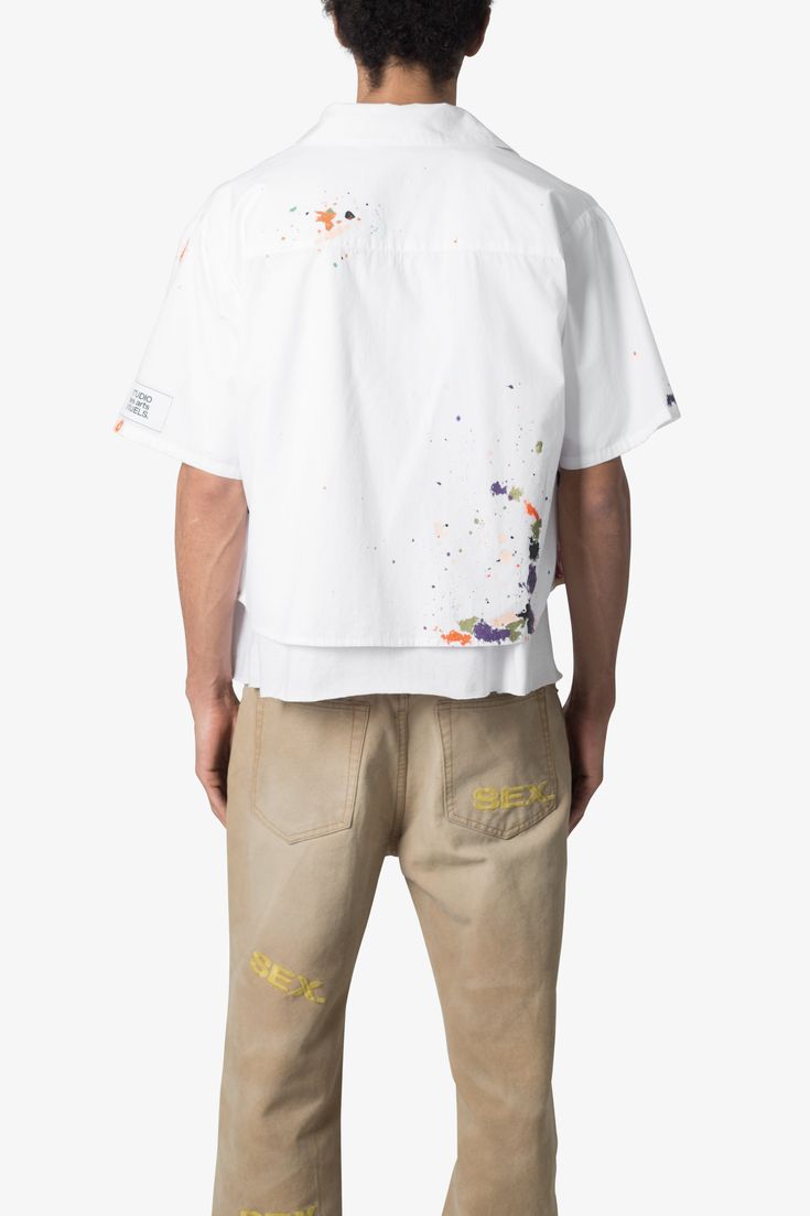 the Poplin Painter S/S Shirt is made from a lightweight cotton fabric. The relaxed-fit shirt features a button placket, paint details throughout, and is finished with a pocket on the chest. details relaxed, cropped fit 100% cotton model is 6’0, 140 lbs and wears a size medium Summer Streetwear Tops With Paint Splatter, Cotton Paint Splatter Tops For Streetwear, Streetwear Cotton Tops With Paint Splatter, Casual Paint Splatter Tops For Summer, Summer Short Sleeve Top With Paint Splatter, Spring Cotton T-shirt With Paint Splatter, Spring Short Sleeve Tops With Paint Splatter, Spring Paint Splatter Short Sleeve Tops, Relaxed Fit Cotton Top With Paint Splatter