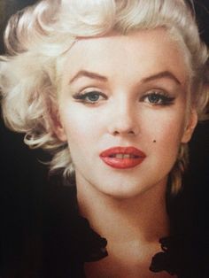 a woman with blonde hair and red lipstick