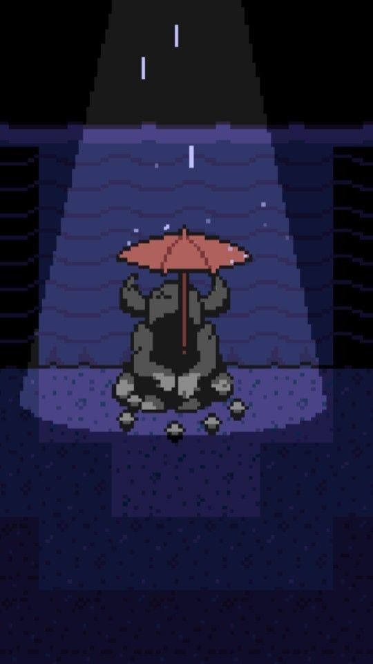 an animal with an umbrella sitting on the ground in front of a light that says it's raining