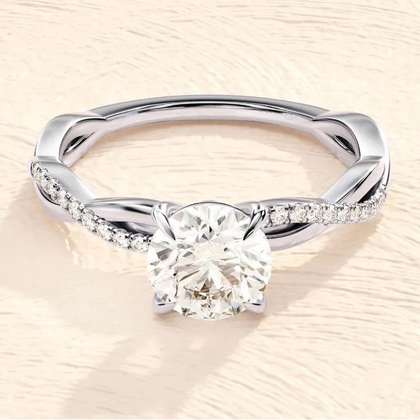 a white gold engagement ring with diamonds on it