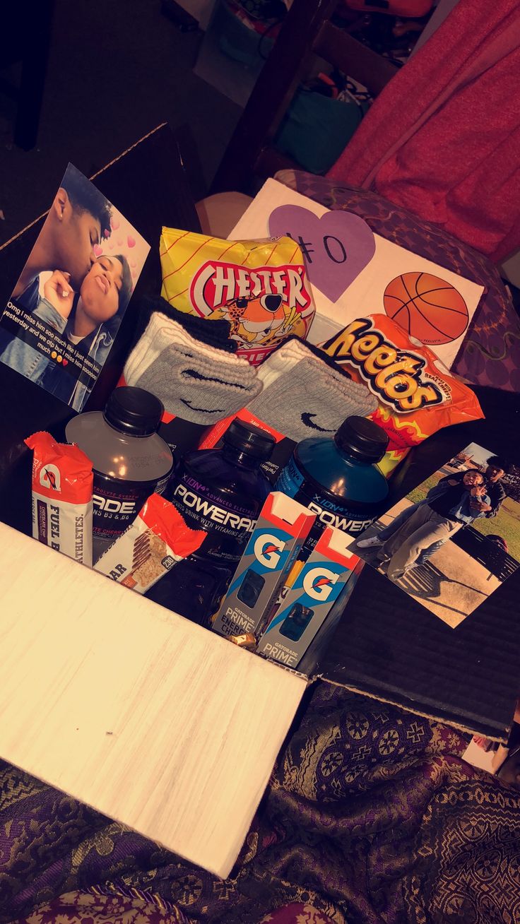 an assortment of sports related items on a bed