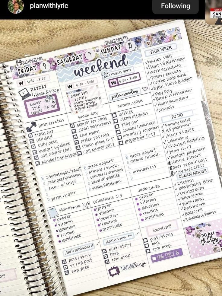 a planner is open on top of a wooden table