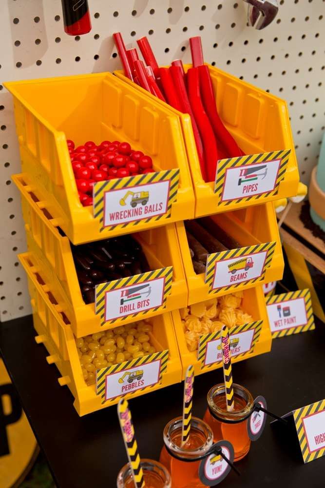 two yellow bins filled with food on top of a table