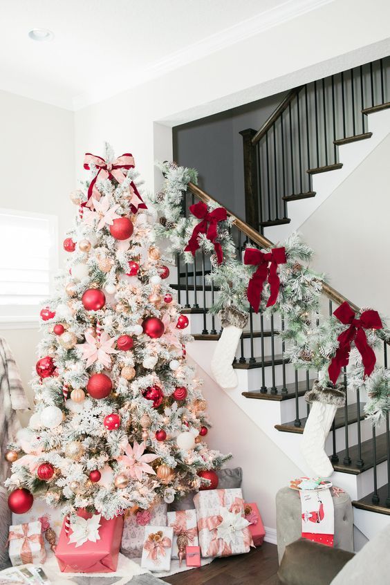 a decorated christmas tree with presents under it